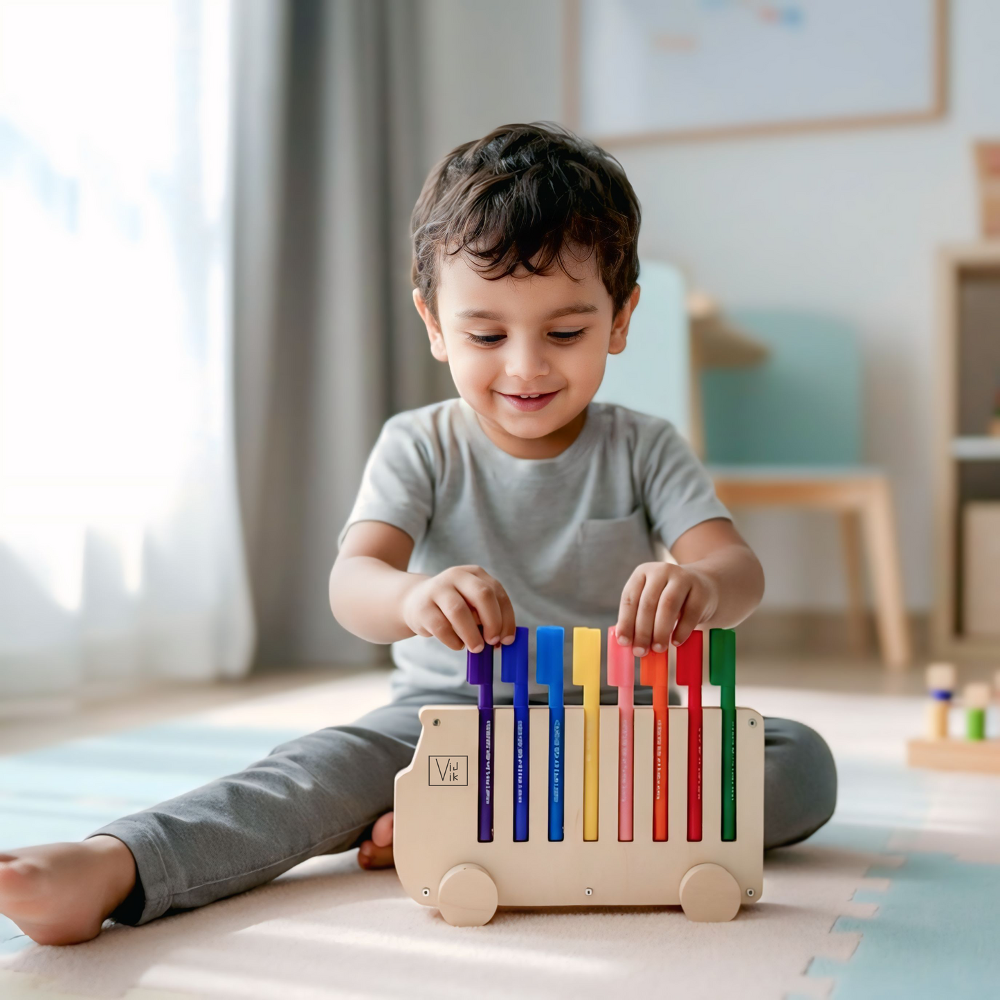 Child playing with a colorful wooden toy in a bright room
